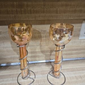 Set of 2 Floating candle standsAmber sunset color glass in a silver colored spi